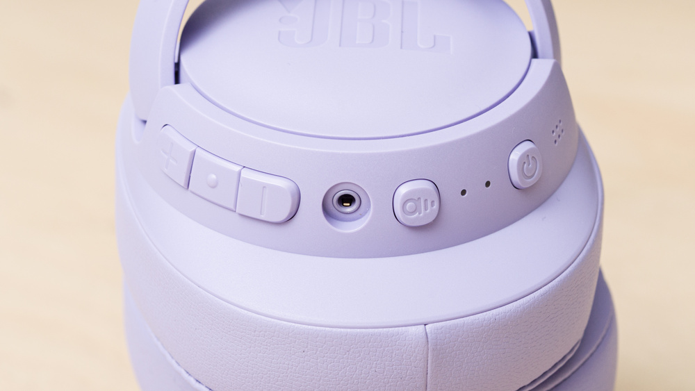 A close up of the JBL Tune 770NC's on-ear controls.