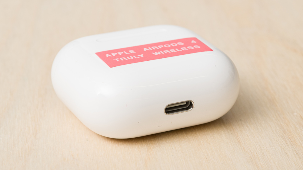 A close up of the Apple AirPods 4 case shows the USB-C port.