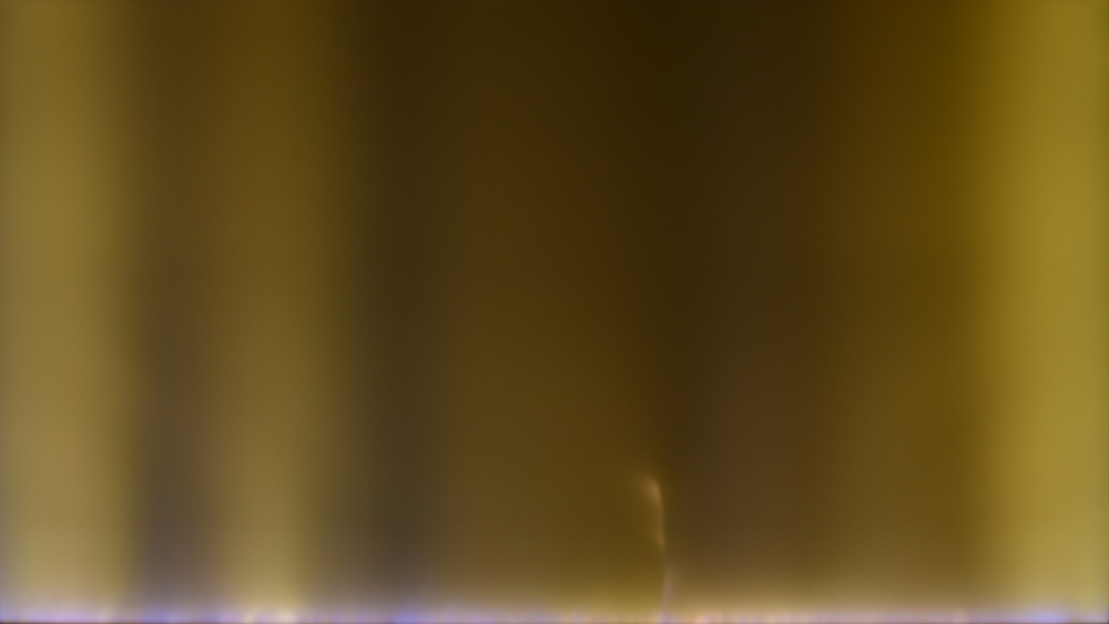 A photo showing the failed backlight on the Samsung Q60B, with multiple dark areas across the screen and a crack along the bottom.