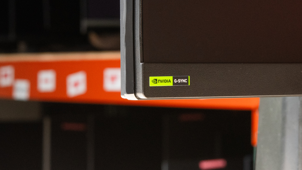 A monitor showing a sticker with G-SYNC Compatibility.