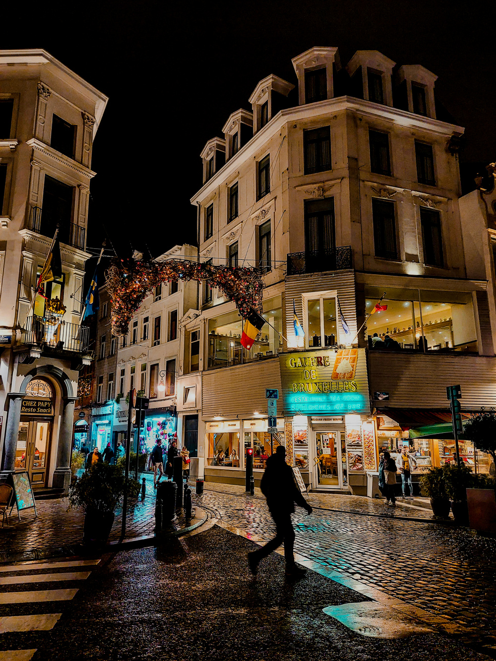 A cityscape night with tone mapping and light source dimming. The sky is black, and highlights pop more in the image.