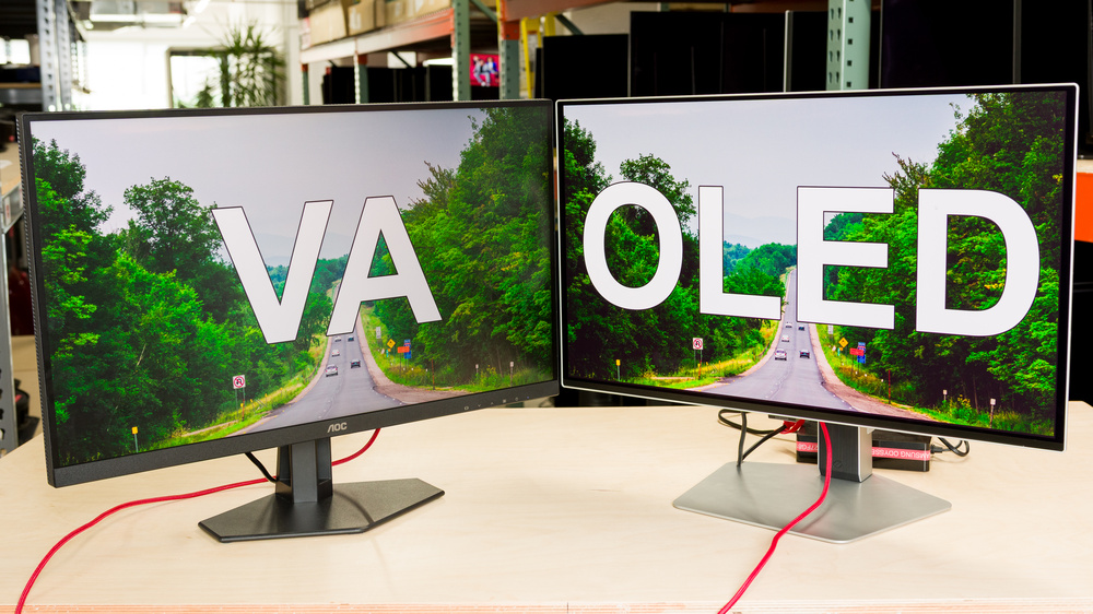 A VA monitor next to an OLED monitor.