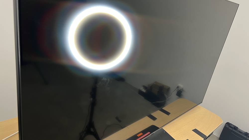 A bright light makes it easier to see small imperfections in a screen.