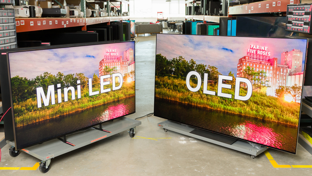 A Mini LED TV and OLED TV standing next to each other.