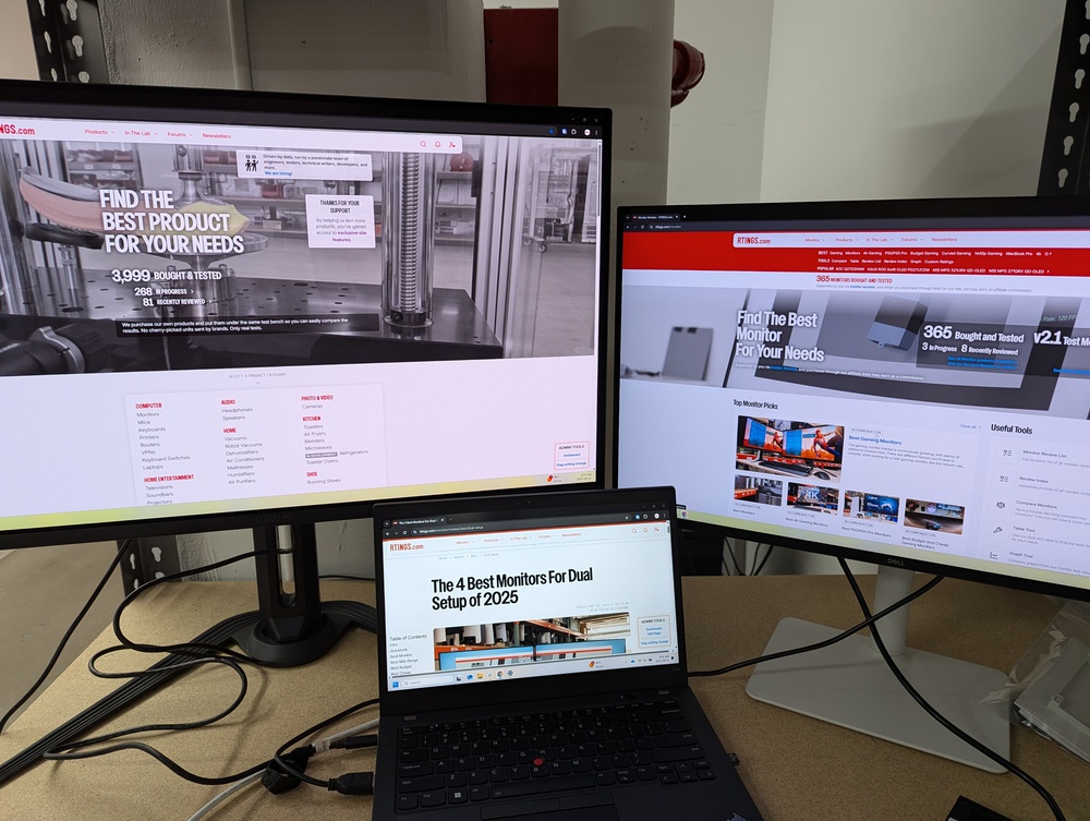 Two monitors connected to a laptop.