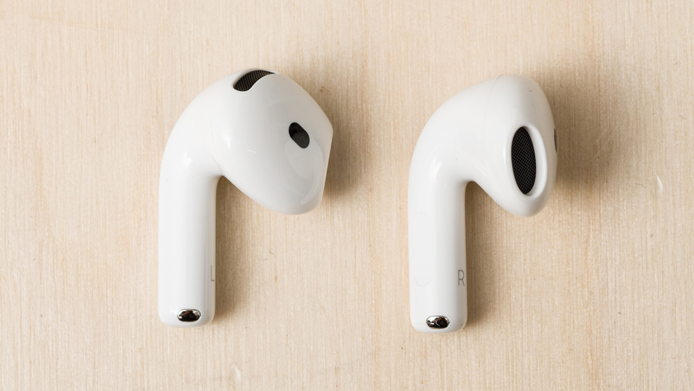The Apple AirPods 4 with Active Noise Cancellation feature mesh-covered grilles on the outside that give them an open-back design.