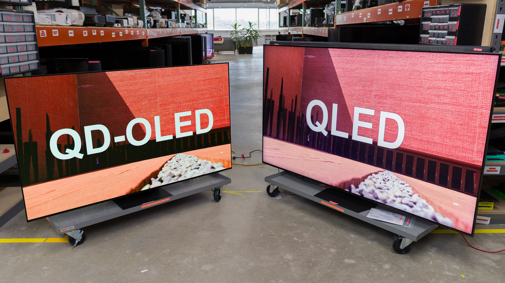 Two TVs side by side: one displays the word QD-OLED and the other QLED.
