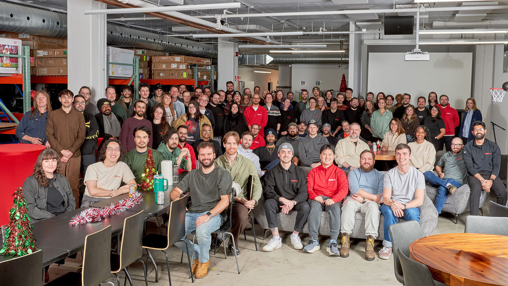 All of the RTINGS.com employees sitting in their office.