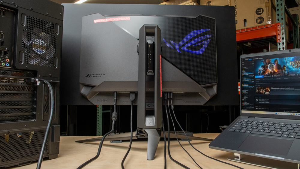 A computer and a laptop connected to a monitor that supports a KVM switch.