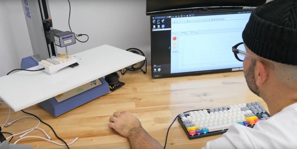 A photo of one of our testers performing a keyboard switch test.