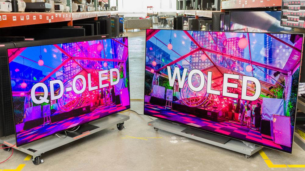 A photo of two TVs with the text QD-OLED on one and WOLED on the other