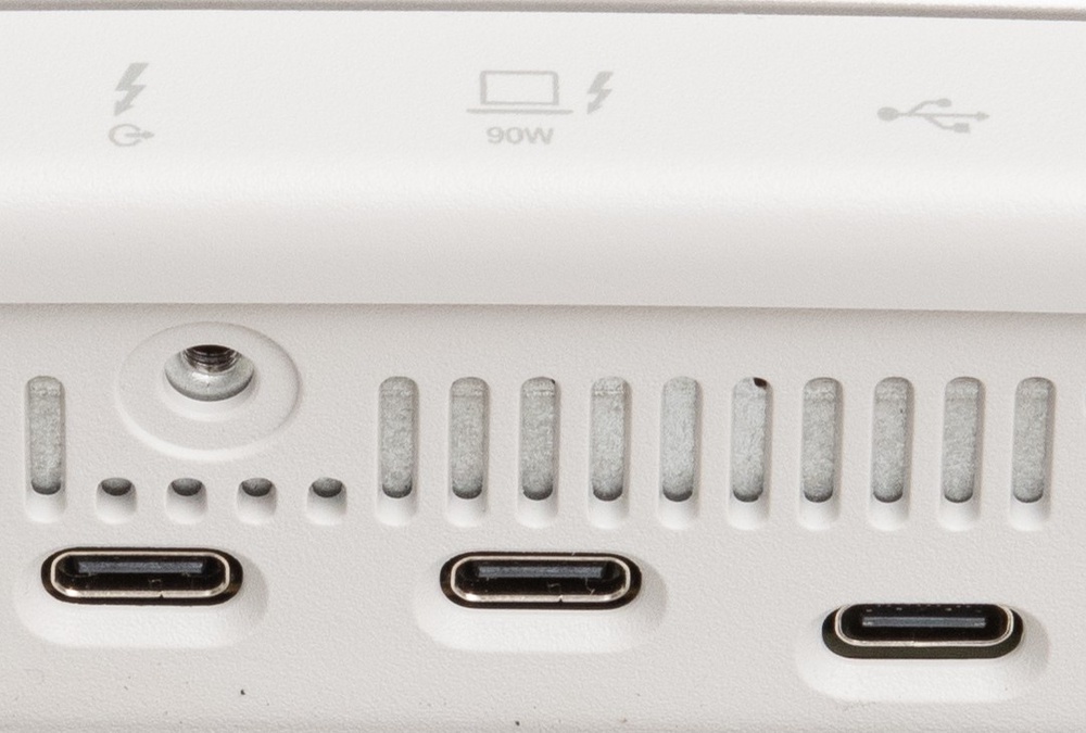 Two Thunderbolt USB-C ports next to a regular USB-C port.