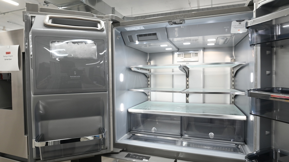 Ice maker located inside the refrigerator door of the KitchenAid KRMF706ESS.