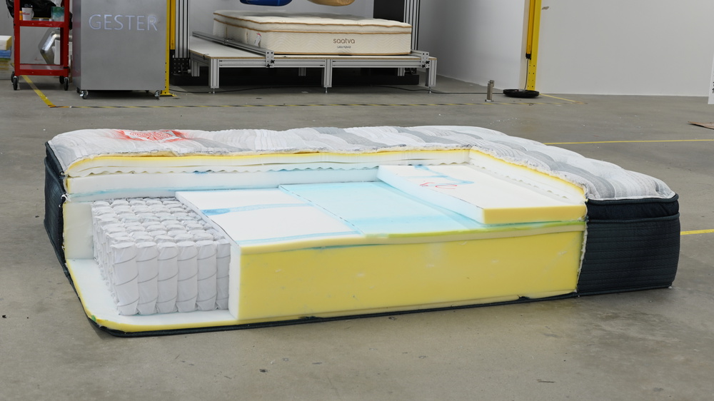 The Beautyrest Harmony Lux cut open to show the spring and foam layers inside.